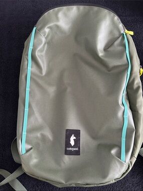 cotopaxi Olive Backpack with Teal Trim and Yellow Pulls